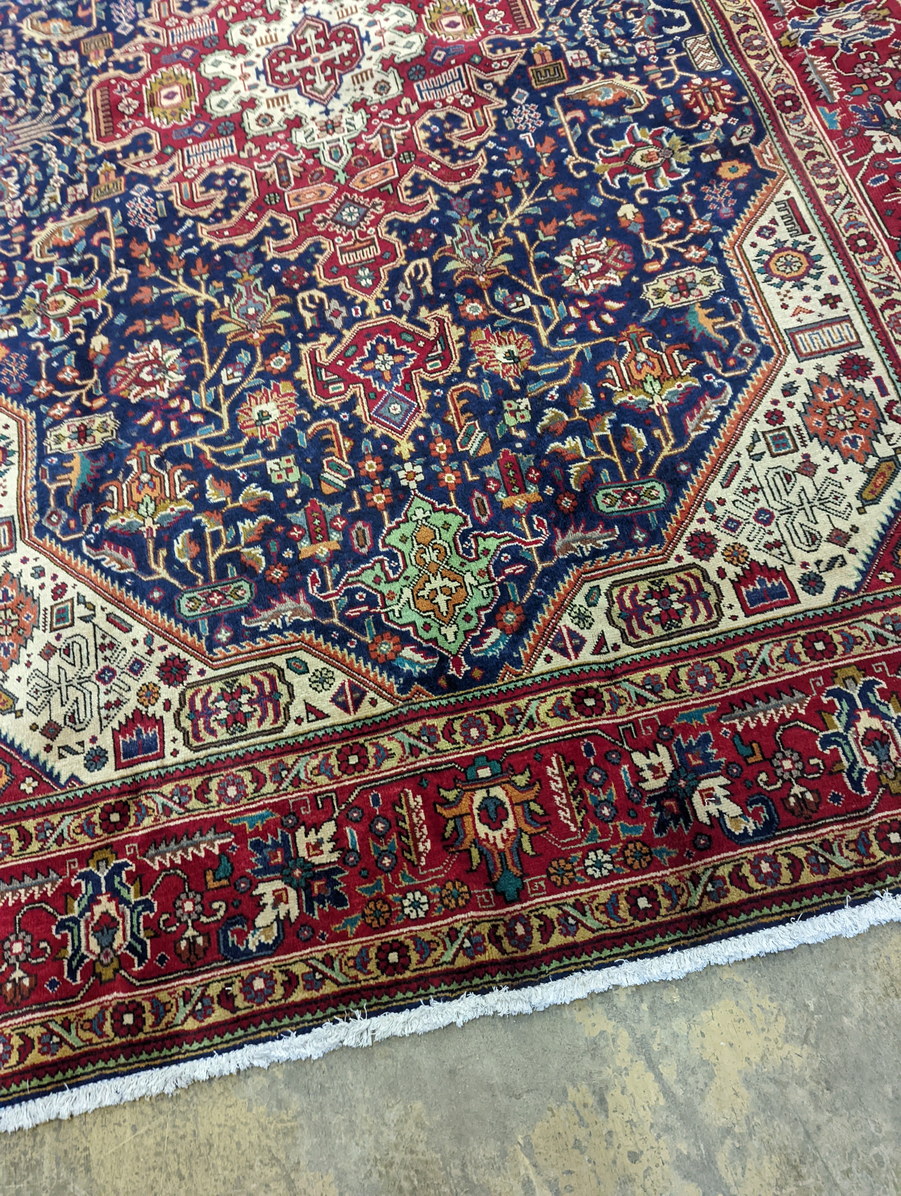 A Tabriz blue ground carpet, 290 x 200cm